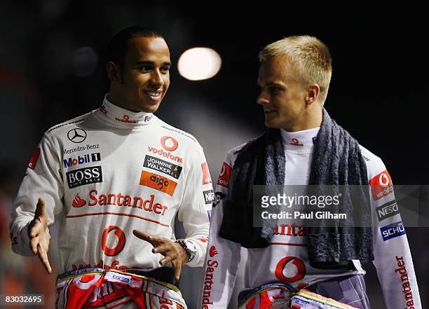 Lewis Hamilton of Great Britain and McLaren Mercedes and Heikki Kovalainen of Finland and McLaren Mercedes are seen following qualifying for the...