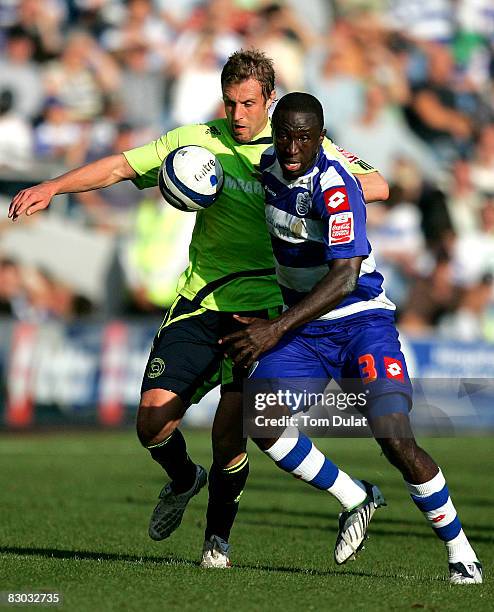Damion Stewart of Queens Park Rangers and Rob Hulse of Derby County compete for the ball during the Coca Cola Championship match between Queens Park...