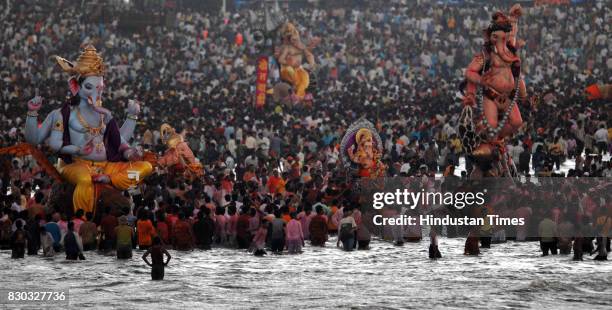 Ganpati Visarjan: Devotees carry a statue of Ganesh Idol , for immersion in the sea in Mumbai.