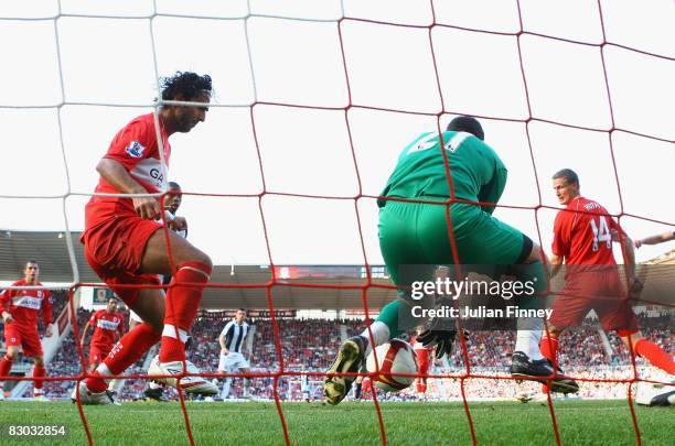 Jonas Olsson of West Bromwich Albion scores a goal as Ross Turnbull of Middlesbrough fails to save the ball during the Barclays Premier League match...