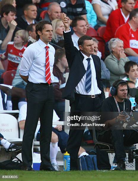 Tony Mowbray, manager of West Brom gives instructions as Gareth Southgate, manager of Middlesbrough looks on during the Barclays Premier League match...