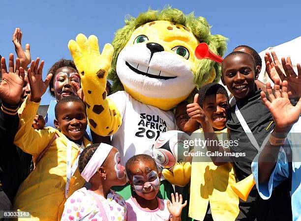 Zakumi, the 2010 FIFA World Cup South Africa mascot, poses with children during the My School 2010 Adventure to promote the 2010 FIFA World Cup South...