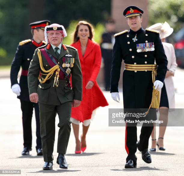 King Abdullah II of Jordan accompanied by Queen Rania of Jordan represents Queen Elizabeth II as he attends the Sovereign's Parade at the Royal...