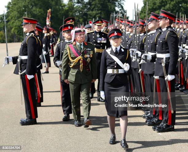 King Abdullah II of Jordan inspects the Officer Cadets as he represents Queen Elizabeth II during the Sovereign's Parade at the Royal Military...