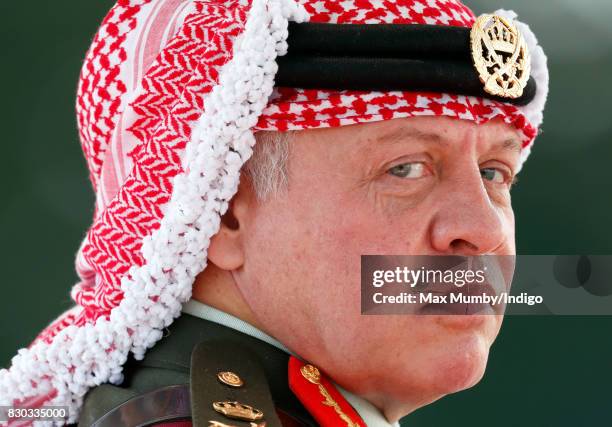 King Abdullah II of Jordan represents Queen Elizabeth II as he attends the Sovereign's Parade at the Royal Military Academy Sandhurst on August 11,...