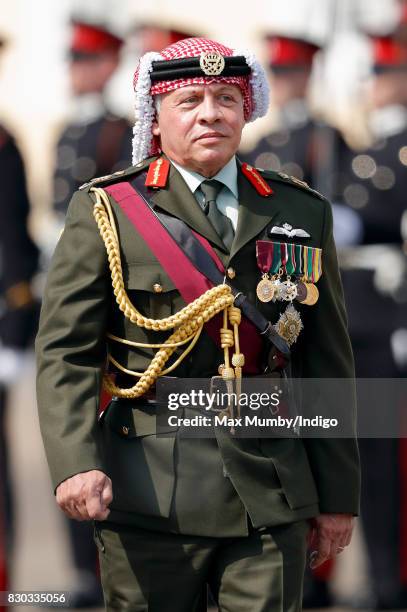 King Abdullah II of Jordan inspects the Officer Cadets as he represents Queen Elizabeth II during the Sovereign's Parade at the Royal Military...