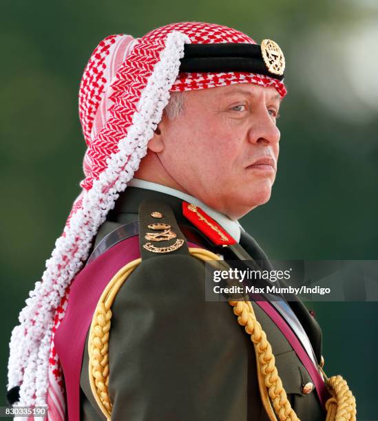 King Abdullah II of Jordan represents Queen Elizabeth II as he attends the Sovereign's Parade at the Royal Military Academy Sandhurst on August 11,...