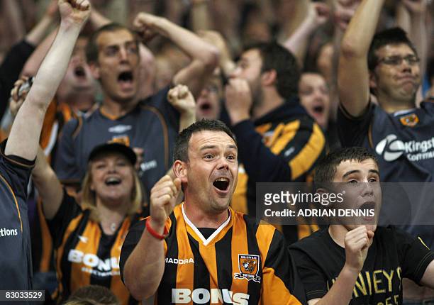 Hull City fans react to a late save by their goalkeeper Boaz Myhill against Arsenal during the Premiership match at The Emirates Stadium in London on...