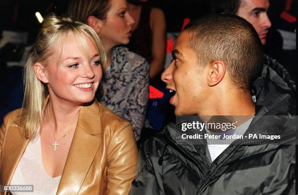 Baby Spice Emma Bunton with boyfriend Jade from the boy band Damage enjoy the designs by Julien MacDonald during London Fashion Week.