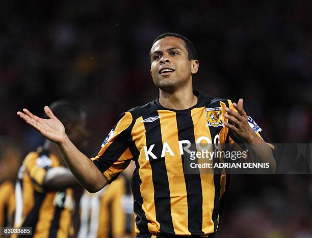 Hull City's Brazilian player Geovanni celebrates after scoring the opening goal against Arsenal during Premiership match at The Emirates Stadium in...