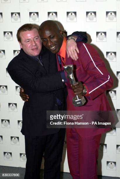Actor Ray Winstone and clothes designer Ozwald Boateng, winner of British Menswear Designer of the Year, at the Rover British Fashion Awards 2000,...