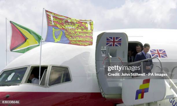 The Prince of Wales flies the flag as he arrives at the International airport, in Georgetown, Guyana.