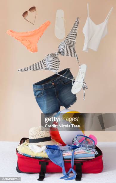 clothes packing shot for summer holiday - floating stock pictures, royalty-free photos & images