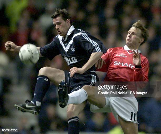 This picture can only be used within the context of an editorial feature. Manchester United's Teddy Sheringham challenges Francois Grenet of FC...