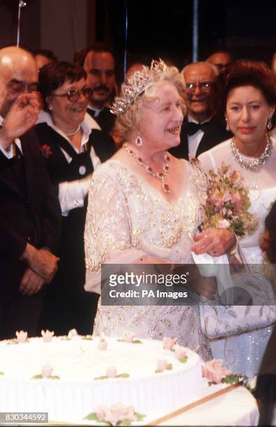 The Queen Mother and Princess Margaret at a cake-cutting ceremony on the Queen Mother's 80th Birthday, on stage at the Royal Opera House, Covent...