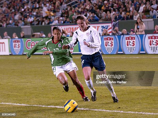 Brandi Chastain for USA and a Mexico Player during the "Fan Celebration Tour" finale on December 8, 2004 at The Home Depot Center in Carson,...