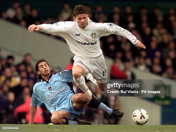 This picture can only be used within the context of an editorial feature. Leeds United's Eirik Bakke is brought down by Coventry City's Youssef...