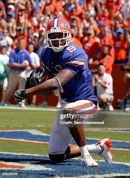 Louis Murphy of the Florida Gators looks toward the crowd after scoring a touchdown against the Ole Miss Rebels at Ben Hill Griffin Stadium on...