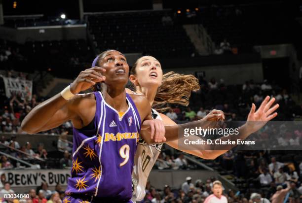 Lisa Leslie of the Los Angeles Sparks rebounds against Ruth Riley of the San Antonio Silver Stars in Game Two of the Western Conference Finals during...