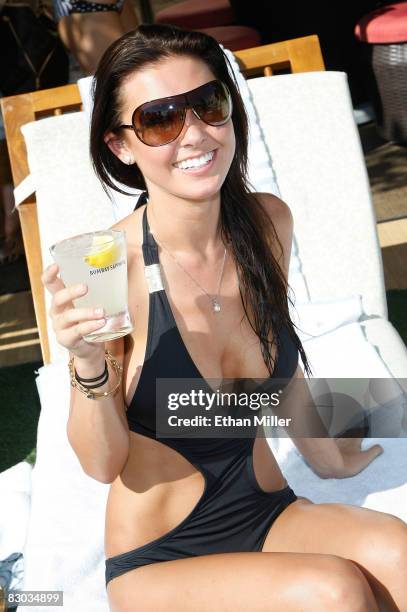 Television personality Audrina Patridge poses while hosting a Bombay Sapphire event at the Wet Republic pool at the MGM Grand Hotel/Casino September...