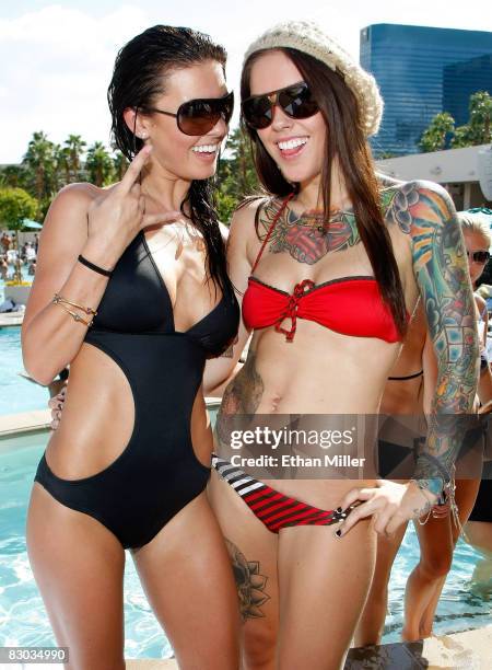 Television personality Audrina Patridge poses with her sister Casey Patridge while hosting a Bombay Sapphire event at the Wet Republic pool at the...