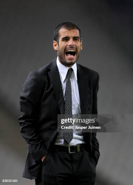 Coach Pep Guardiola of Barcelona shouts to his players during the La Liga match between Espanyol and Barcelona at the Montjuic Olympic Stadium on...