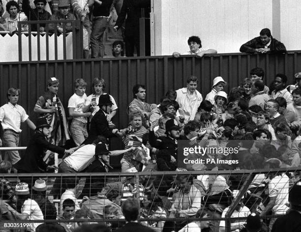 Truncheons at the ready, police officers tackle unruly fans of Glasgow Rangers at White Hart Lane ground, London, where Tottenham Hotspur met Rangers...