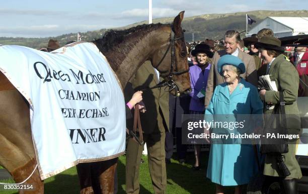 The Queen Mother meets Edredon Bleu, the winner of the Queen Mother Champion Chase, with winning trainer Henrietta Knight during the second day of...