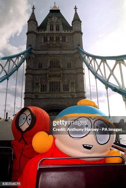 Kenny and Cartman, characters from the South Park cartoon television show ride on top of an open-topped bus along Tower Bridge, London, to launch the...