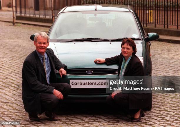 Dr Tony Lewis, a GP from Budleigh Salterton, Devon, and his wife Penny with a Ford Focus car in London, at the launch of the Consumers Association's...
