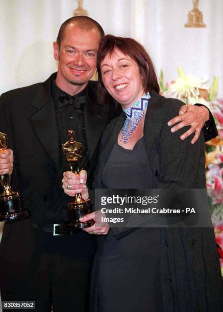 British pair Christine Blundell and Trevor Proud with their Oscars which they won for Best Make Up for their work on the film Topsy Turvey, at the...