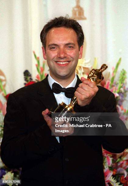 British director, Sam Mendes with his Oscar for Best Director which he won for his film American Beauty, at the 72nd Annual Academy Awards, held at...