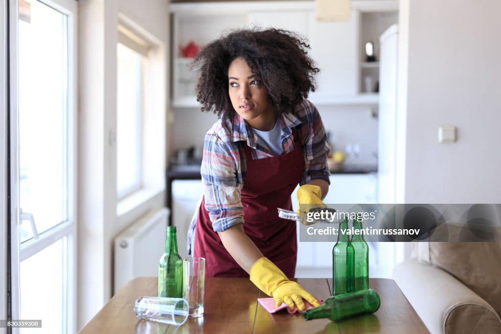 Young Woman Cleaning Kitchen