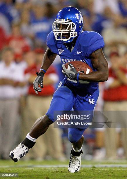 Alfonso Smith of the Kentucky Widcats runs with the ball during the game against the Western Kentucky Hilltoppers at Commonwealth Stadium on...