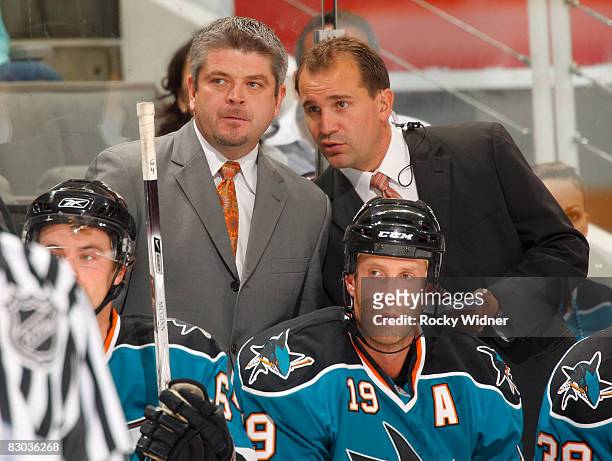 Todd McLellan and Todd Richards of the San Jose Sharks talk strategy during an NHL preseason game against the Vancouver Canucks on September 27, 2008...