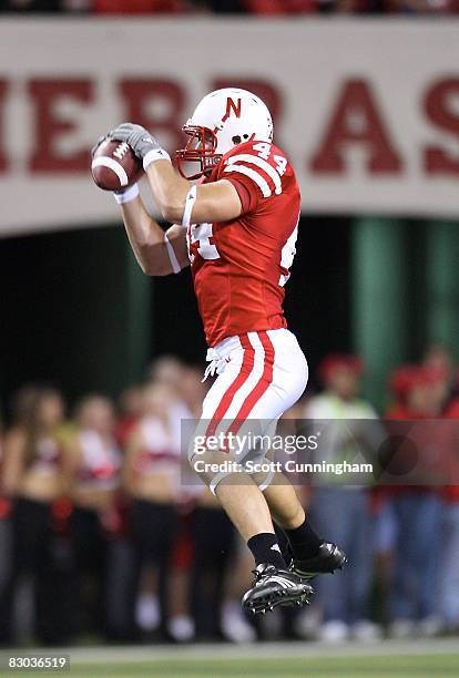 Mike McNeill of the Nebraska Cornhuskers makes a catch against the Virginia Tech Hokies at Memorial Stadium on September 27, 2008 in Lincoln,...