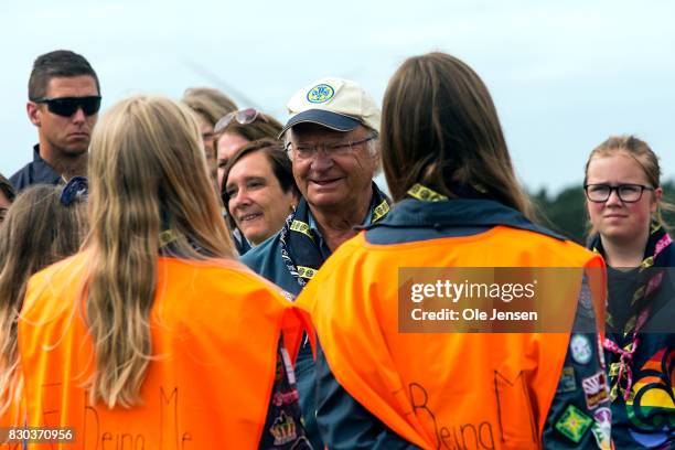 Swedish King Carl Gustav talks to scouts during his visit to the scouts jamboree on August 11, 2017 in Kristianstad, Sweden. The King took a long...