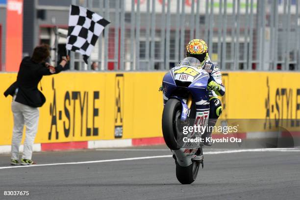 Valentino Rossi of Italy and the Fiat Yamaha Team celebrates his victory after crossing the finish line during the MotoGP World Championship Grand...