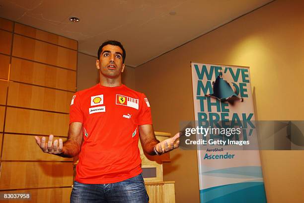 Ferrari test driver Marc Gene of Spain gives a talk at a Shell luncheon at the Pan Pacific Hotel prior to the Singapore Formula One Grand Prix at the...