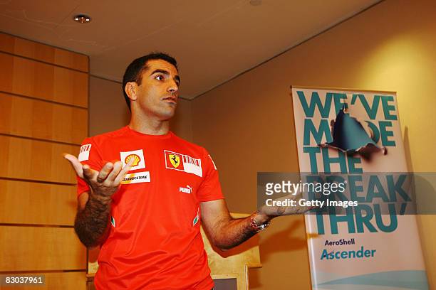 Ferrari test driver Marc Gene of Spain gives a talk at a Shell luncheon at the Pan Pacific Hotel prior to the Singapore Formula One Grand Prix at the...