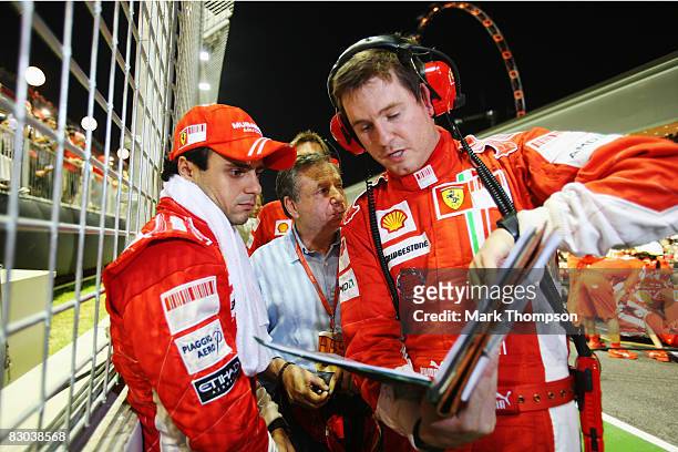 Felipe Massa of Brazil and Ferrari is seen on the grid before the start of the Singapore Formula One Grand Prix at the Marina Bay Street Circuit on...