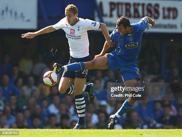 Glen Little of Portsmouth battles with Michael Dawson of Tottenham Hotspur during the Barclays Premier League match between Portsmouth and Tottenham...