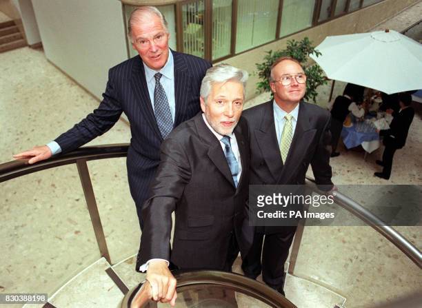 British Telecom Chief executive Peter Bonfield stands with Sir Iain Vallance, Chairman of British Telecom and Robert Brace BT Financial Director in...