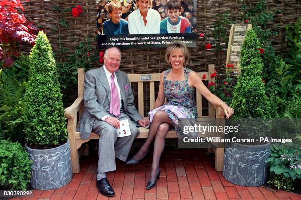 Presenter Esther Rantzen with her husband Desmond Wilcox sit on the Diana, Princess of Wales garden bench at the Chelsea Flower Show. The Memorial...