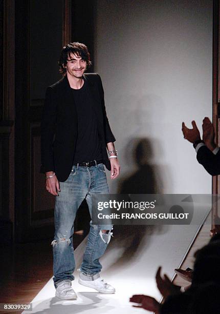 French designer Christophe Decarnin for Balmain acknowledges the public at the end of the spring/summer 2009 ready-to-wear collection show in Paris,...
