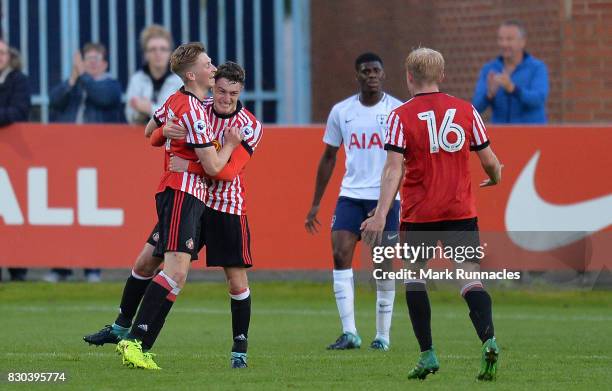 Denver Hume of Sunderland is congratulated by his team mates after scoring the winning goal during the Premier League 2 match between Sunderland and...