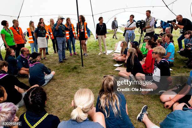Swedish King Carl Gustav discus with young girls about their project 'Free Being Me' during his visit to the scouts jamboree on August 11, 2017 in...