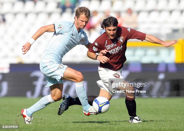 Rolando Bianchi of Torino and David Rozenthal of Lazio in action during the Serie A match between Torino and Lazio at the Stadio Comunale on...