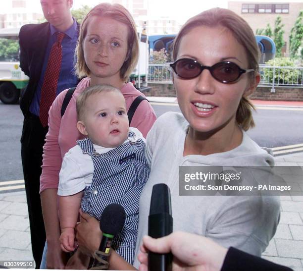 Frankie Dettori's wife Catherine and baby Leo arrive at Addenbrooke's Hospital, Cambridge, to visit her injured jockey husband, who is recovering...