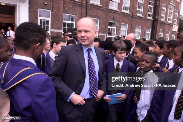 Conservative Leader William Hague makes his way through a sea of pupils during a visit to Archbishop Tenison's School in London, to promote the...